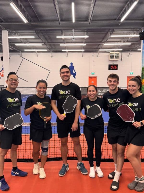 Players in action on the pickleball court